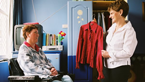 A Disability Support Worker assists a patient with a cognitive disability